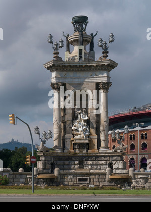 BARCELONA, SPAIN - SEPTEMBER 13, 2013: The Central Fountain designed by Josep Maria Jujol in the Placa d'Espanya with the Arenas Bullring Stock Photo