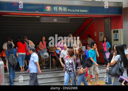 Hong Kong China,HK,Asia,Chinese,Oriental,Kowloon,Mong Kok,Nathan Road,Mong Kok MTR Subway Station,entrance,exit,riders,Asian adult,adults,woman female Stock Photo