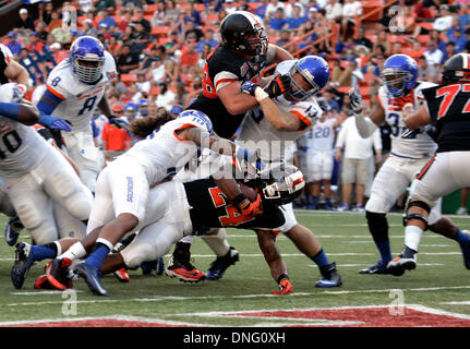 Honolulu, HI, USA. 24th Dec, 2013. December 24, 2013 Boise State Broncos safety Jeremy Ioane #10 is unable to stop Oregon State Beavers running back Storm Woods #24 from scoring a touchdown during action between the Oregon State Beavers and Boise State Broncos at the Sheraton Hawaii Bowl at Aloha Stadium in Honolulu, HI. © csm/Alamy Live News Stock Photo