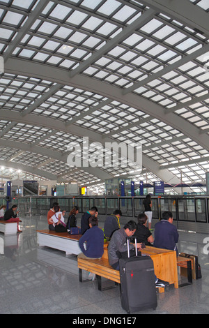 Beijing China,Chinese,Beijing Capital International Airport,PEK,Terminal 3,T3,Express Train Station,platform,Asian man men male,waiting,interior insid Stock Photo