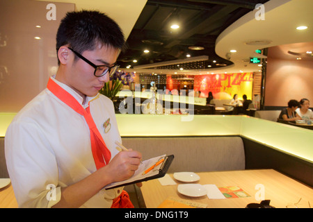 Beijing China,Chinese,The Malls at Oriental Plaza,Pizza Hut,restaurant restaurants food dining cafe cafes,cuisine,food,interior inside,Asian man men m Stock Photo