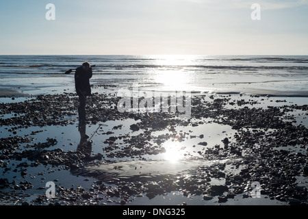 A man searches for metal on Worthing beach in the Boxing Day Sun. 26/12/2013 at Seafront, Worthing. Picture by Julie Edwards Stock Photo