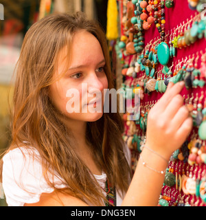 Teen-girl in the Asian gift shop. Stock Photo