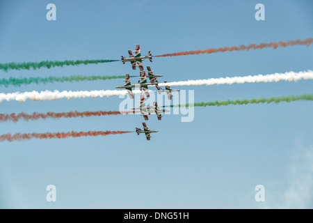 The Italian Aerobatic Display Team Il Frecce Tricolori perform a daring head on crossover pass during their display at the RIAT Stock Photo