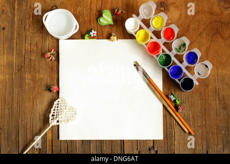 painting set - brushes, paints (gouache) on old wooden table Stock Photo
