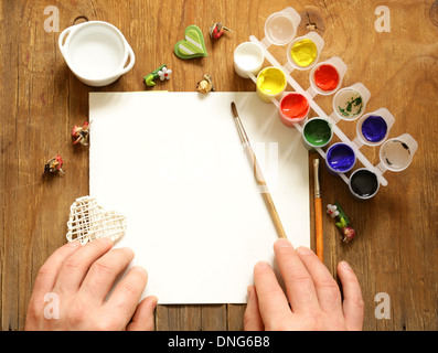 painting set - brushes, paints (gouache) on old wooden table Stock Photo