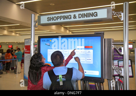 Miami Florida,South,Miami Dade County,Miami International Airport,MIA,terminal,sign,electronic,monitor,flat panel,screen,information,shopping shopper Stock Photo