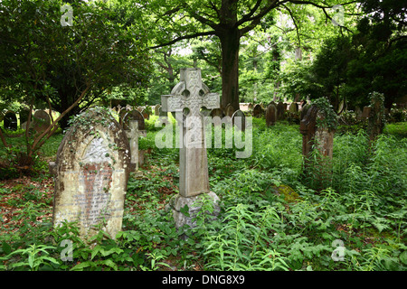 Graves in overgrown churchyard of St Peters church , Southborough Common, near Tunbridge Wells , Kent , England Stock Photo