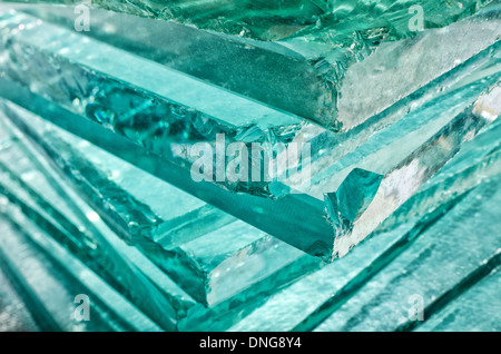 Sharp dangerous edge of plate glass internal reflection brings out green color and depth Stock Photo