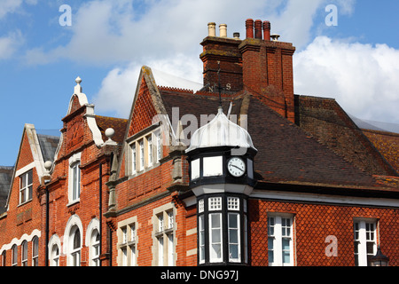 Detail of gables and chimneys on Victorian brick buildings in High Street, Tonbridge, Kent , England Stock Photo