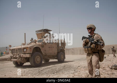 Dec. 27, 2013 - (FILE PHOTO) - The U.S. military is reportedly planning to scrap as many as 2,000 MRPs in Afghanistan and sell them as scrap. MRAPS, which cost 1 Million dollars each, are costly to ship back to the U.S., rather than scrap them for money in Afghanistan. PICTURED: Apr 30, 2011 - Naw Za, Helmand, Afghanistan - A U.S. Marine of Lima Company, 3rd Battalion of 2nd Marine Regiment watches an M-ATV (Mine Resistant Ambush Protected All Terrain Vehicle) pass by near Forward Operating Base Caferatta in the town of Naw Zad in Naw Zad district in Helmand province, Afghanistan. While secur Stock Photo