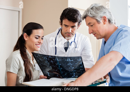 Medical Professionals Reviewing X-ray Stock Photo