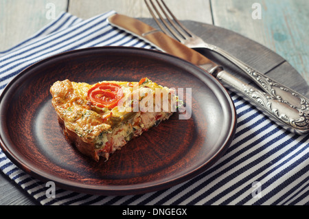 Frittata with Fresh Vegetables and chicken meat on plate Stock Photo