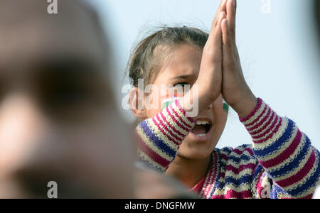 New Delhi, India. 28th Dec, 2013. A young supporter of Aam Aadmi Party (AAP) comes to the Ramlila Ground to witness the swearing-in ceremony of party leaders in New Delhi, India, Dec. 28, 2013. The AAP won 28 of Delhi's 70 assembly seats in elections held earlier this month, paving the way for its leader, Arvind Kejriwal, to become the Chief Minister of Delhi. Kejriwal, a former civil servant, campaigned to rid Delhi's government of corruption and inefficiency. Credit:  Partha Sarkar/Xinhua/Alamy Live News Stock Photo