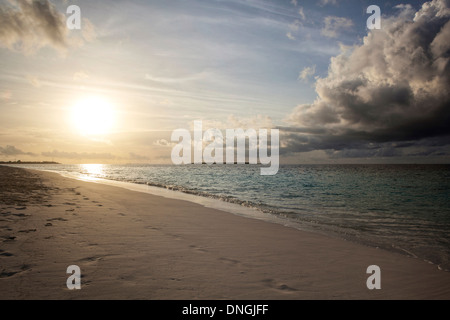 Sunset over a beach on an Island in The Maldives Stock Photo