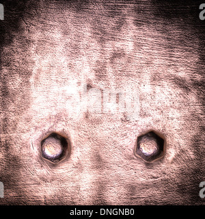 Closeup of grunge red metal plate with rivet screw as background or texture. Square format. Stock Photo