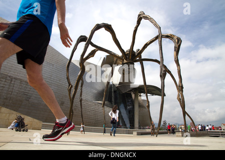 People visiting modern art Bilbao province of Biscay northern Spain. Spider art Guggenheim Museum. Stock Photo