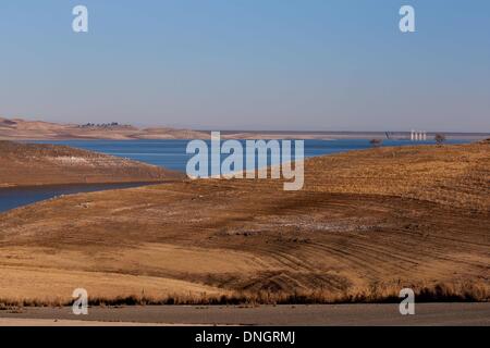 Los Banos, CA, USA. 28th Dec, 2013. A look at the San Luis Reservoir from Fifield Rd on the west side of the reservoir towards the dam on the east side shows the level lines and how low the water level is. With the lack of rain and snow in the northern California area several of the reservoirs are seeing record lows in the water levels. San Luis Reservoir is one of those that has dropped to record levels. As of news reports in Aug. 2013 it was at 17% of capacity. Credit:  Marty Bicek/ZUMAPRESS.com/Alamy Live News Stock Photo