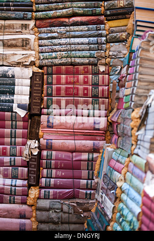 piles of many old italian books in second-hand bookseller shop Stock Photo