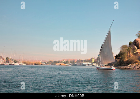 Traditional Felucca Boat sailing on the River Nile around the islands at Aswan, Egypt. Stock Photo
