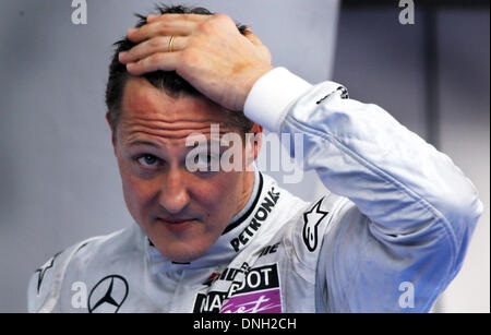 FILE: Sepang near Kuala Lumpur, Malaysia. 3rd April 2010. German then Formula One driver Michael Schumacher in the pit lane during the qualifying in Sepang near Kuala Lumpur, Malaysia. According to reports, Michael Schumacher on 29 December 2013 has suffered serious head injuries while skiing in Meribel, France. Photo: Jens Buettner/dpadpa/Alamy Live News Stock Photo