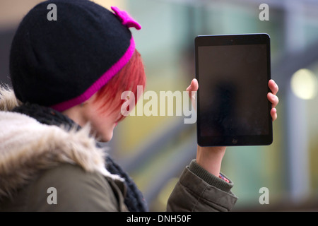 A girl holds an iPad. Stock Photo