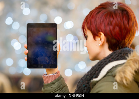 A girl holds an iPad. Stock Photo