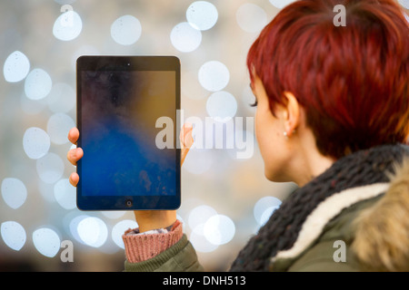 A girl holds an iPad. Stock Photo