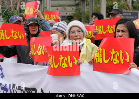 Naha, Japan. 27th Dec, 2013. Hundreds of Okinawa residents protest against the approval of the U.S. military base relocation in front of a prefectural government office on December 27, 2013 in Naha, Okinawa, Japan. Okinawa Governor Hirokazu Nakaima on the same day approved landfill work to relocate the U.S. Marine Corps' Futenma Air Station to Henoko district, an area within his prefecture, going back on his previous policy of seeking to have the base moved out of Okinawa. © Wataru Kohayakawa/AFLO/Alamy Live News Stock Photo