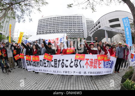 Naha, Japan. 27th Dec, 2013. Hundreds of Okinawa residents protest against the approval of the U.S. military base relocation in front of a prefectural government office on December 27, 2013 in Naha, Okinawa, Japan. Okinawa Governor Hirokazu Nakaima on the same day approved landfill work to relocate the U.S. Marine Corps' Futenma Air Station to Henoko district, an area within his prefecture, going back on his previous policy of seeking to have the base moved out of Okinawa. © Wataru Kohayakawa/AFLO/Alamy Live News Stock Photo