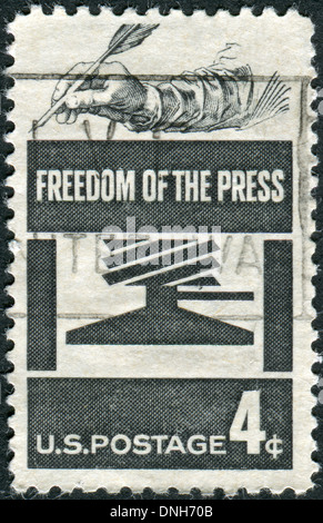 USA - CIRCA 1958: Postage stamp printed in USA, Freedom of Press Issue, shows Early Press and Hand Holding Quill, circa 1958 Stock Photo