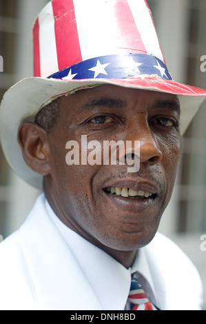 Portrait of a street performer dressed in a hat and tie with stars and stripes, in the French Quarter of New Orleans, Louisiana. Stock Photo