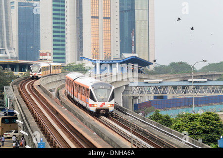 Modern Asian transport infrastructure: driverless commuter trains, elevated tracks and station Stock Photo