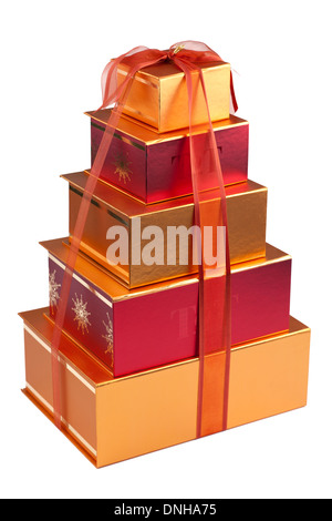 Stack of red gift boxes with ribbon and gold bow isolated on white ...