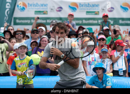 Brisbane, Australia. 30th Dec, 2013. Roger Federer of Switzerland plays with kids during 'Kids day' event at Brisbane International tennis tournament in Brisbane, Australia, Dec. 30, 2013. Credit:  Bai Xue/Xinhua/Alamy Live News Stock Photo