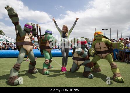 Brisbane, Australia. 30th Dec, 2013. Victoria Azarenka of Belarus (C) poses for photos with cartoon characters during 'Kids day' event at Brisbane International tennis tournament in Brisbane, Australia, Dec. 30, 2013. Credit:  Bai Xue/Xinhua/Alamy Live News Stock Photo