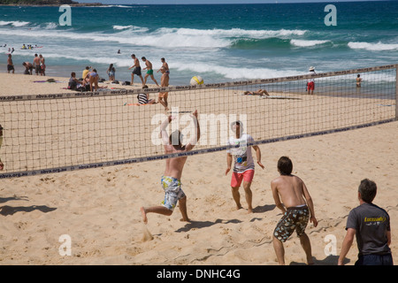 Young boys playing beach volleyball on Manly beach in Sydney,Australia Stock Photo