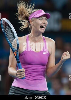 Brisbane, Australia. 30th Dec, 2013. Maria Sharapova of Russia celebrates after winning her women's singles first round match against Caroline Garcia of France at Brisbane International tennis tournament in Brisbane, Australia, Dec. 30, 2013. Maria Sharapova won 2-0. Credit:  Bai Xue/Xinhua/Alamy Live News Stock Photo