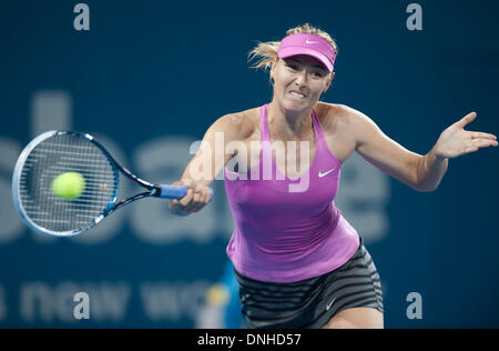 Brisbane, Australia. 30th Dec, 2013. Maria Sharapova of Russia hits a return during her women's singles first round match against Caroline Garcia of France at Brisbane International tennis tournament in Brisbane, Australia, Dec. 30, 2013. Maria Sharapova won 2-0. Credit:  Bai Xue/Xinhua/Alamy Live News Stock Photo