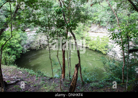 The sacred cenote at Chichen Itza  Mayan ruins on the Yucatan peninsular Mexico North America Stock Photo