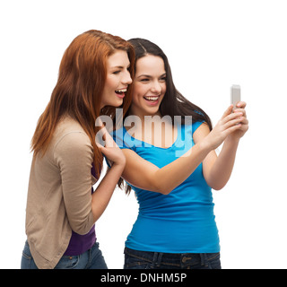 two smiling teenagers with smartphone Stock Photo
