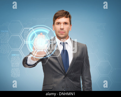 attractive buisnessman working with virtual screen Stock Photo