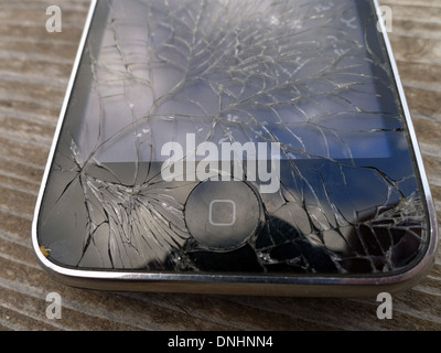 An iPhone with cracked screen Stock Photo