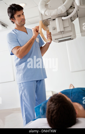 Radiographer taking x-ray of patient Stock Photo - Alamy