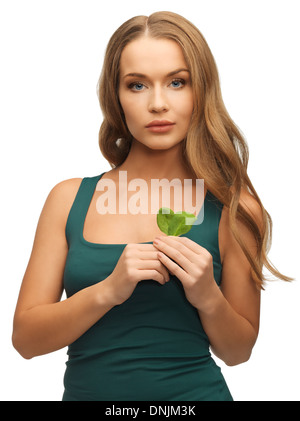 woman with spinach leaves Stock Photo