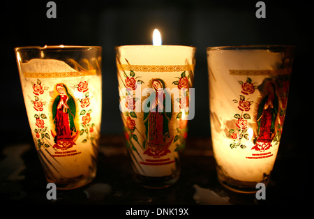 Candles with the image of Our Lady of Guadalupe Candles, Virgin of Rosario chapel, Santo Domingo church, Puebla, Mexico. Stock Photo
