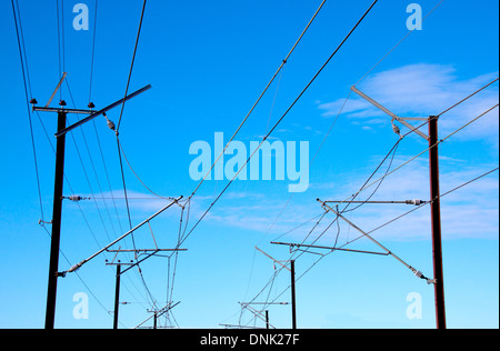 overhead power lines providing power to electric trains Stock Photo