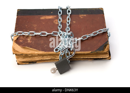 tattered book with chain and padlock isolated on white background Stock Photo