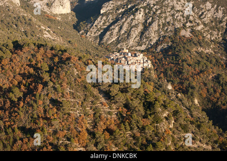 AERIAL VIEW. Perched medieval village in a picturesque setting on a steep mountainside. Peillon, Alpes-Maritimes, French Riviera's hinterland, France. Stock Photo