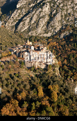 AERIAL VIEW. Perched medieval village in a picturesque setting on a steep mountainside. Peillon, Alpes-Maritimes, French Riviera's hinterland, France. Stock Photo